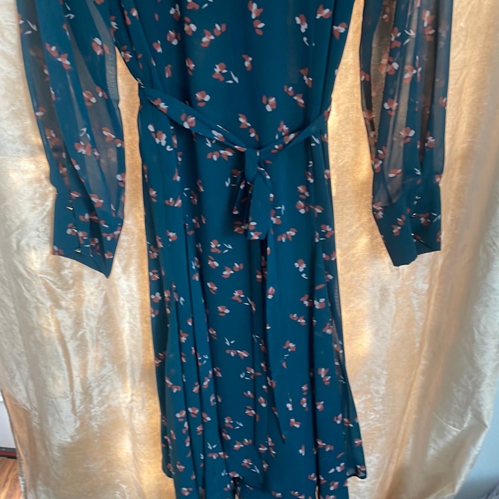 DKNY long Sleeve high neck and handkerchief hem dress.
